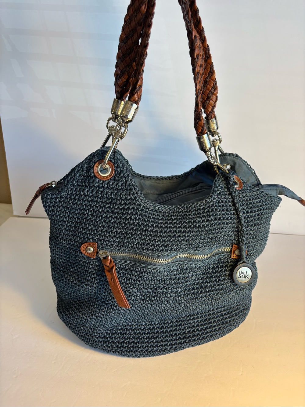 The Sak Navy Crochet Shoulder Bag with Brown Braided Handles